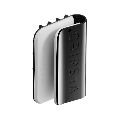 A sleek black and white Gripsta clip, designed for holding items securely, with the brand name embossed on its surface.