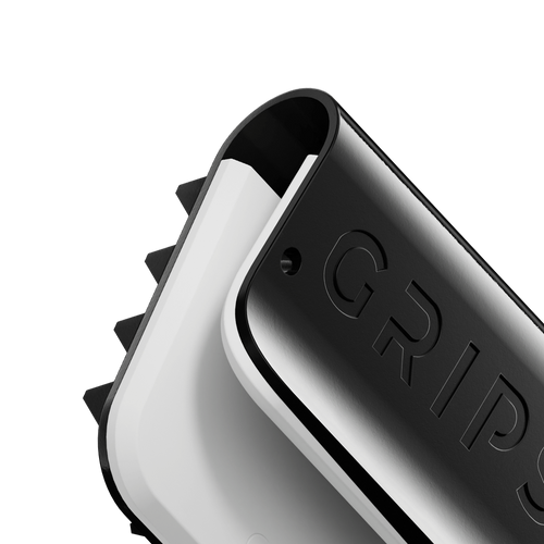 Close-up of a black and white gaming controller with the word GRIPS embossed on it.